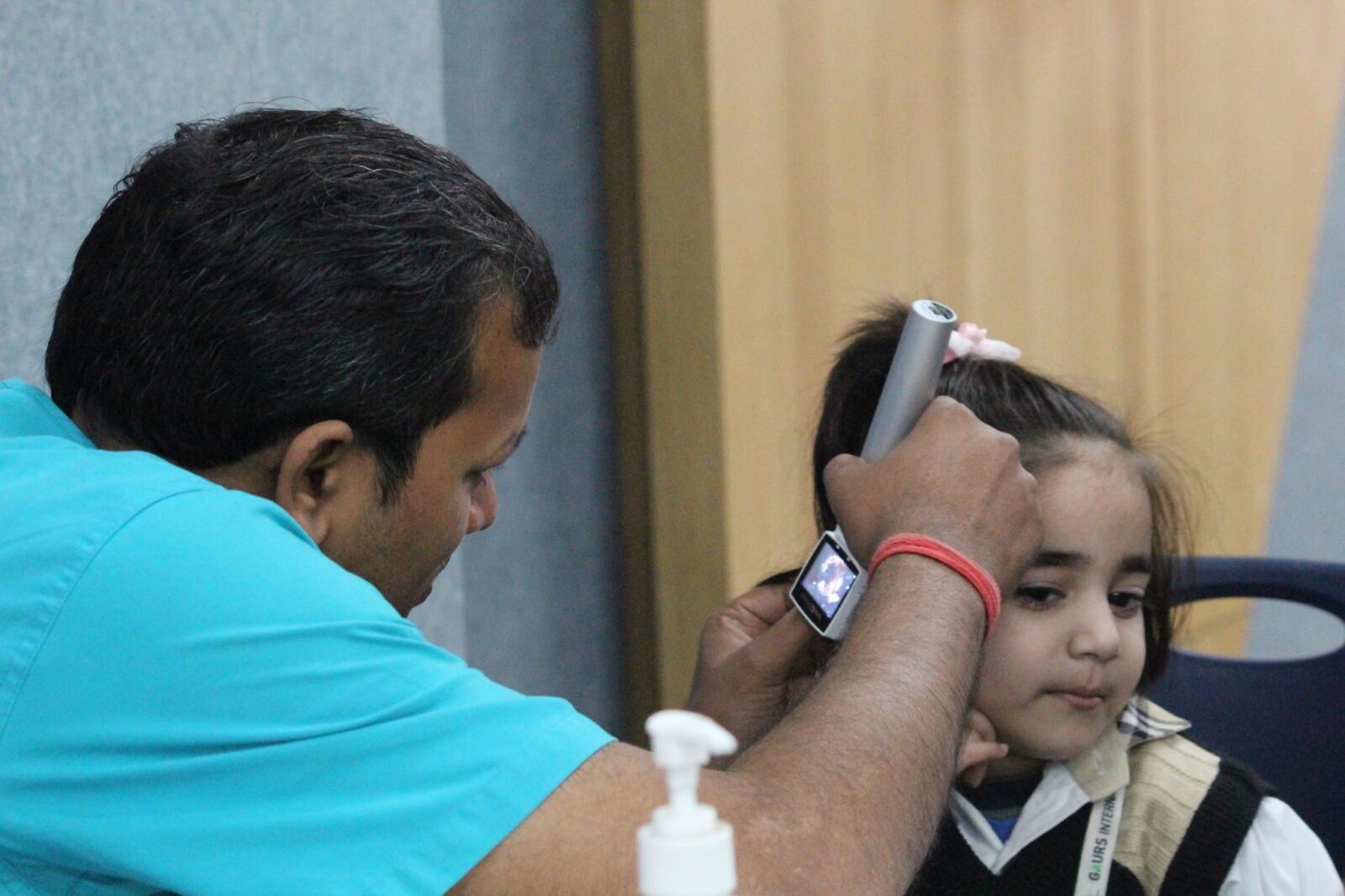 Ear examination during an ENT screening